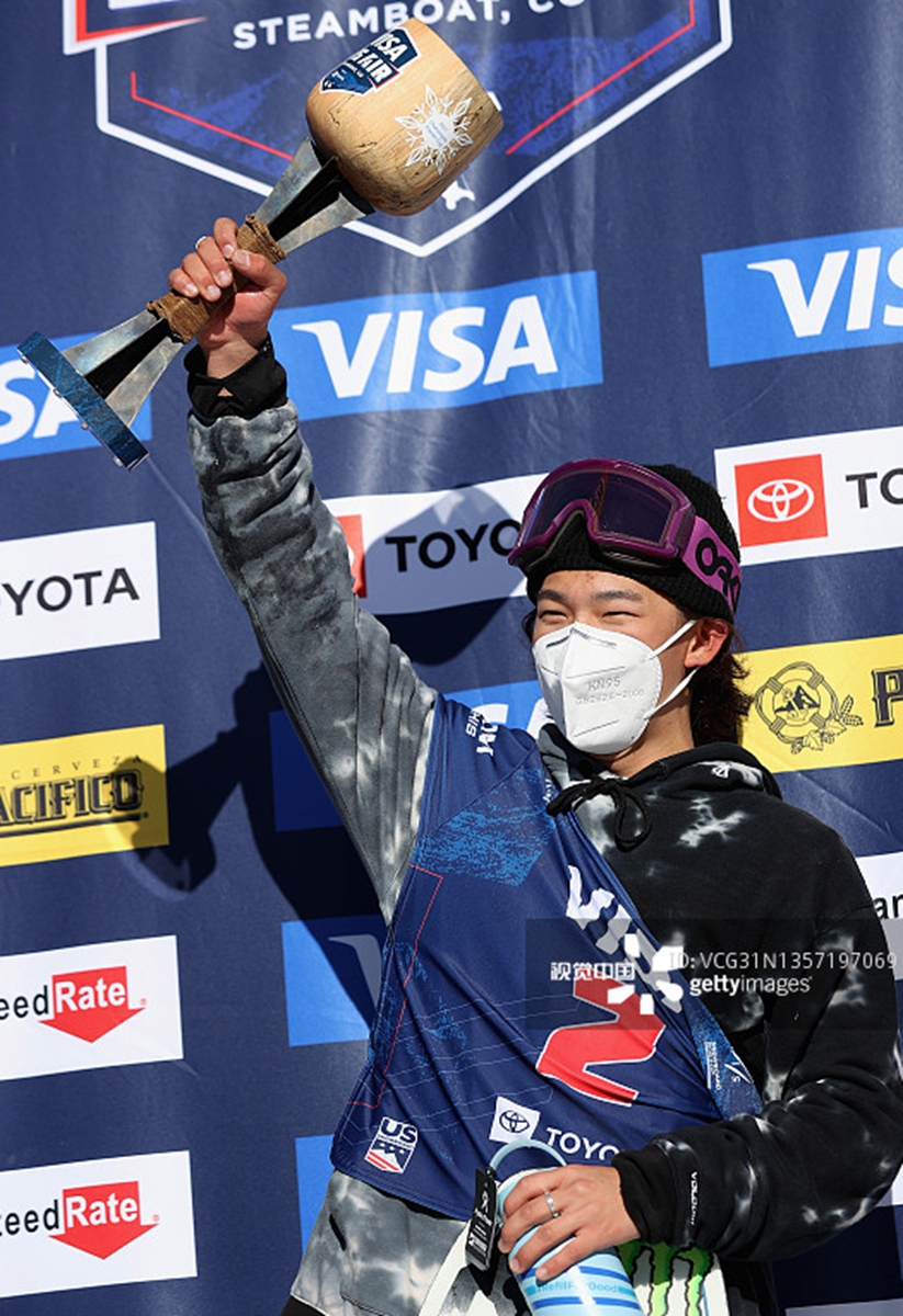 Su Yiming celebrates on the podium after winning the Men's Snowboard Big Air World Cup finals on December 4, 2021 in Steamboat Springs, Colorado. Photo: VCG