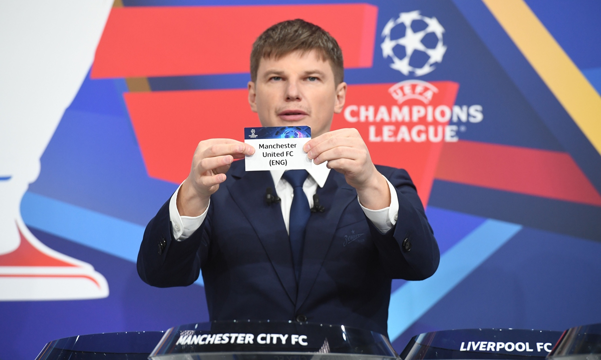 Special guest Andrey Arshavin draws out the card of Manchester United FC during the UEFA Champions League 2021-22 Round of 16 Draw at the UEFA headquarters, on December 13, 2021, in Nyon, Switzerland. Photo: VCG