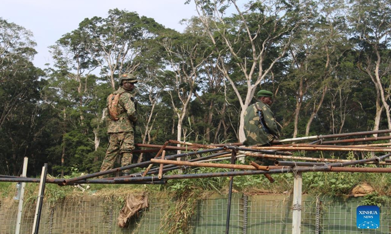 Soldiers from the joint forces of the Uganda People's Defense Forces (UPDF) and the Armed Forces of the Democratic Republic of the Congo (FARDC) guard a make-shift military base in the jungles in Beni territory of North Kivu Province, northeast Democratic Republic of the Congo (DRC), Dec. 9, 2021.(Photo: Xinhua)