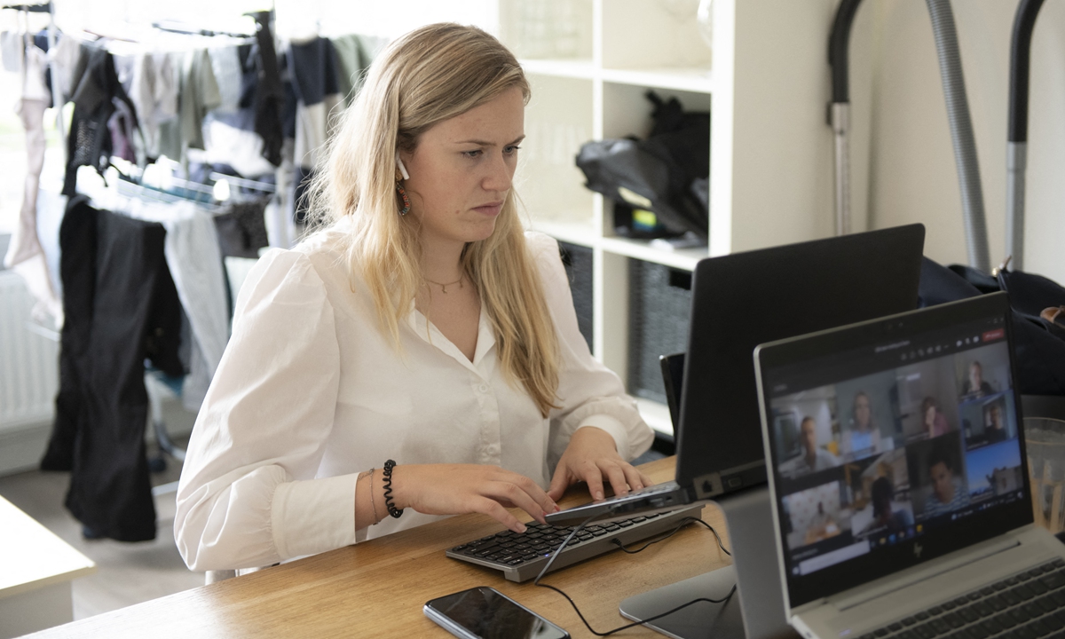 A Young woman works from home during the pandemic. A lot of employees use video-conferencing platforms to hold meetings. Photo: AFP