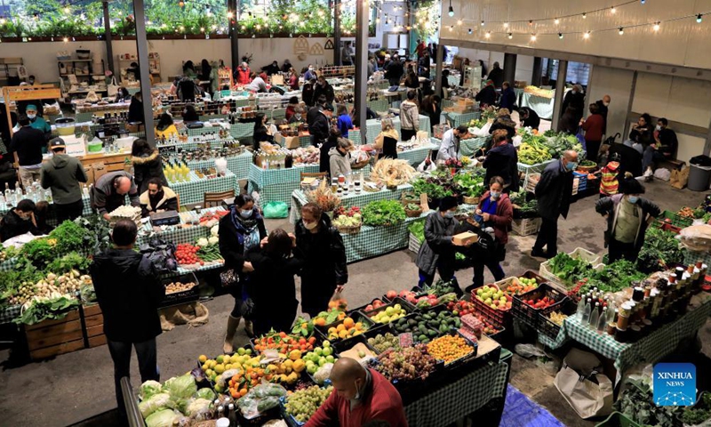 People visit Souk El Tayeb farmers market in Beirut, Lebanon, on Dec. 18, 2021.Photo:Xinhua