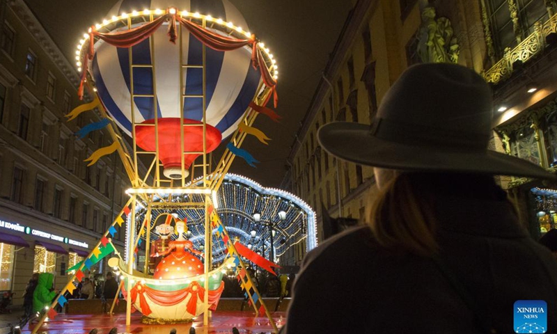 A woman visits the Christmas market in St. Petersburg, Russia, Dec. 18, 2021.Photo:Xinhua