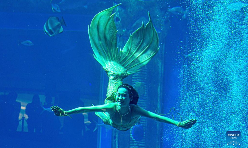 A contestant participates in the final of China's First Mermaid Performance Contest in Sanya, south China's Hainan Province, Dec. 22, 2021. The event, the first national-level professional mermaid competition, was held at Atlantis Sanya in Hainan.(Photo: Xinhua)