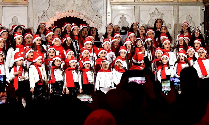 Children stage a musical performance ahead of the Christmas and New Year celebrations in Damascus, Syria, Dec. 21, 2021.(Photo: Xinhua)