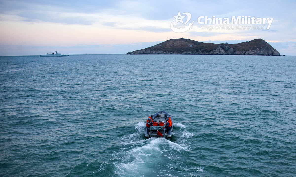 Soldiers aboard a rigid-hull inflatable boat (RHIB) leave for a visit, board, search and seizure (VBSS) operation during a maritime live-fire training exercise in early December, 2021. (eng.chinamil.com.cn/Photo by Liu Min)