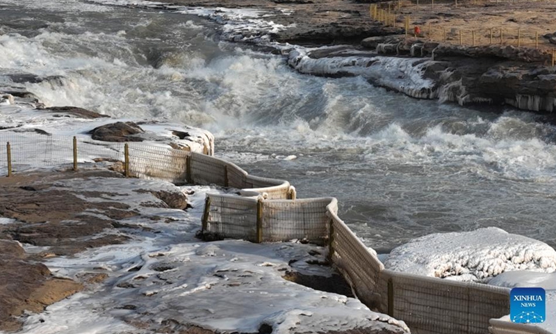 Aerial photo taken on Dec. 30, 2021 shows winter scenery of the Hukou Waterfall on the Yellow River in north China's Shanxi Province.Photo:Xinhua