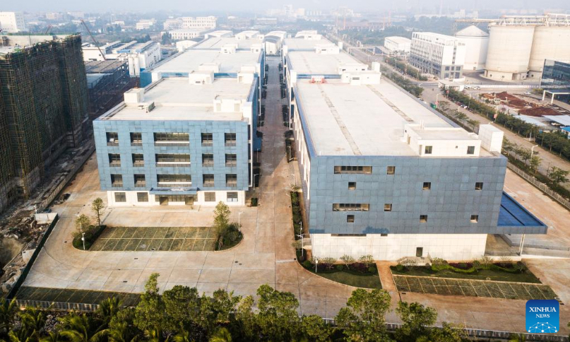 Aerial photo taken on Jan. 2, 2022 shows a factory building and overseas warehouse project at the Yangpu Bonded Port Area in the Yangpu Economic Development Zone, south China's Hainan Province.