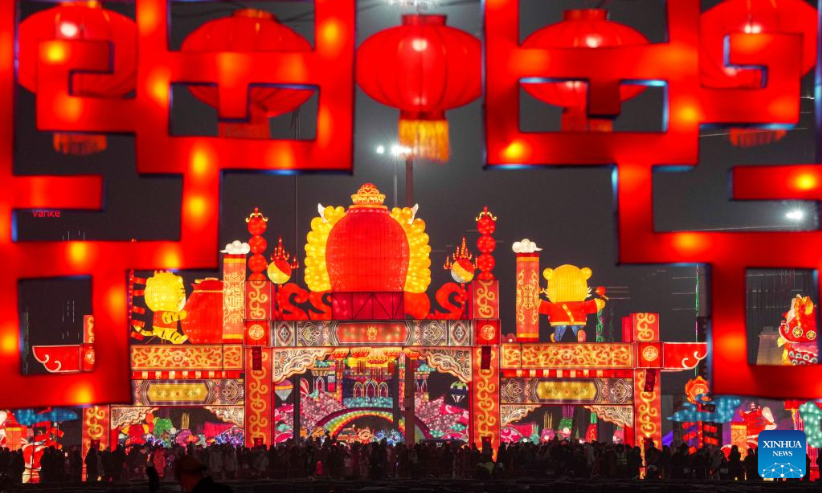 People visit a lantern show at the Xinjiang International Convention and Exhibition Center in Urumqi, northwest China's Xinjiang Uygur Autonomous Region, Jan. 1, 2022. (Xinhua/Hu Huhu)