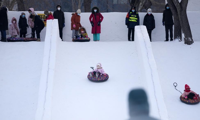 People play at a winter recreation park in Harbin, northeast China's Heilongjiang Province, Jan. 1, 2022. (Xinhua/Wang Jianwei)