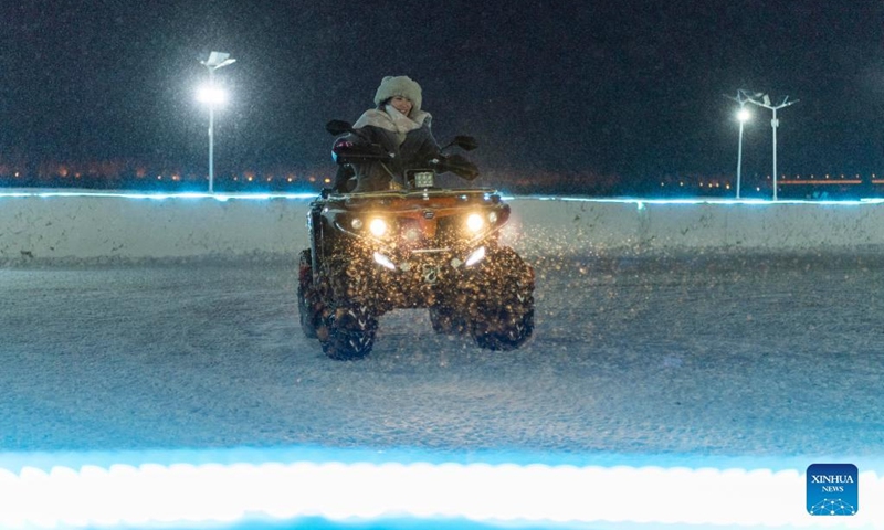 A woman plays at a winter recreation park in Harbin, northeast China's Heilongjiang Province, Jan. 1, 2022. (Xinhua/Xie Jianfei)