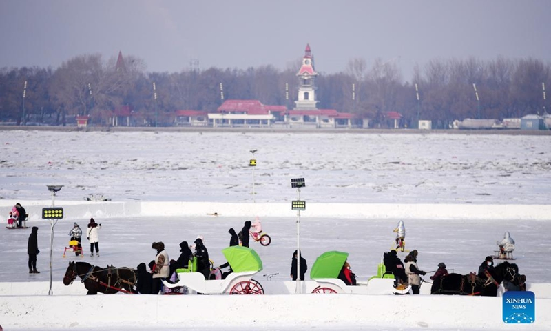 People play at a winter recreation park in Harbin, northeast China's Heilongjiang Province, Jan. 1, 2022. (Xinhua/Wang Jianwei)