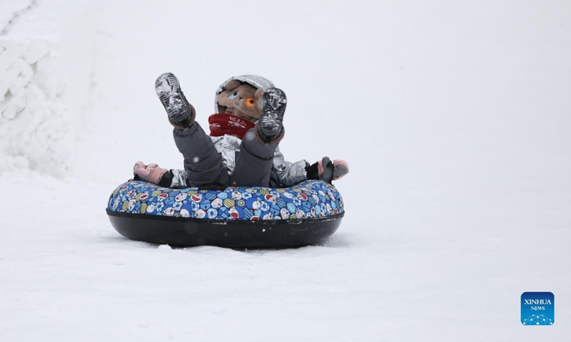 A child plays at a winter recreation park in Harbin, northeast China's Heilongjiang Province, Jan. 1, 2022. (Xinhua/Zhang Tao)