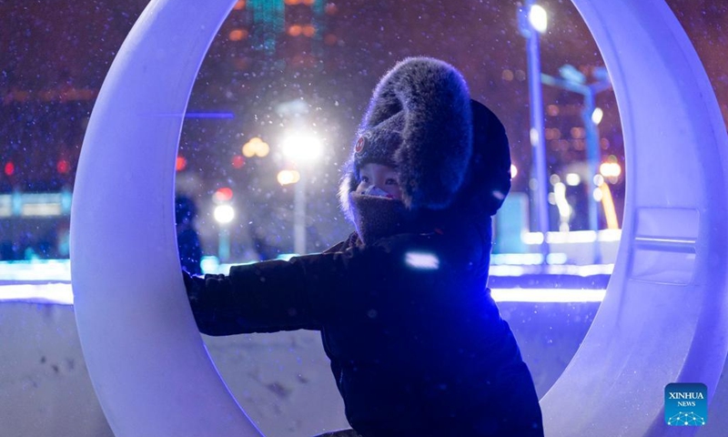 A child plays at a winter recreation park in Harbin, northeast China's Heilongjiang Province, Jan. 1, 2022. (Xinhua/Xie Jianfei)