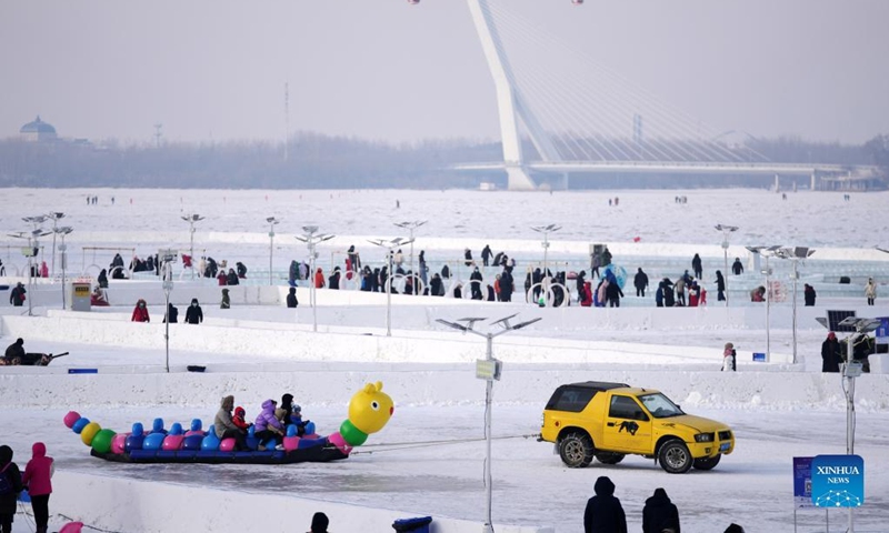 People play at a winter recreation park in Harbin, northeast China's Heilongjiang Province, Jan. 1, 2022. (Xinhua/Wang Jianwei)