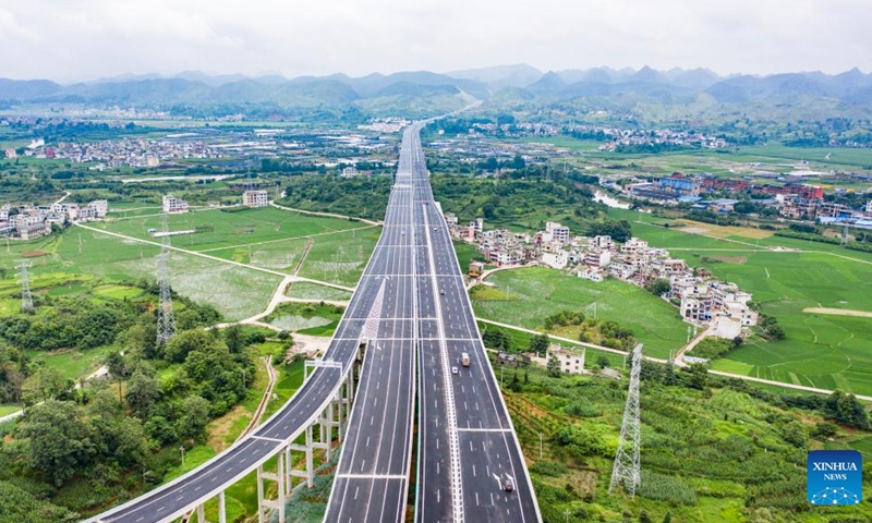 Aerial photo taken on June 28, 2021 shows cars running on the Huishui Bridge of the Duyun-Anshun expressway in southwest China's Guizhou Province. The total length of expressways in Guizhou Province exceeded 8,000 kilometers. (Xinhua/Tao Liang)