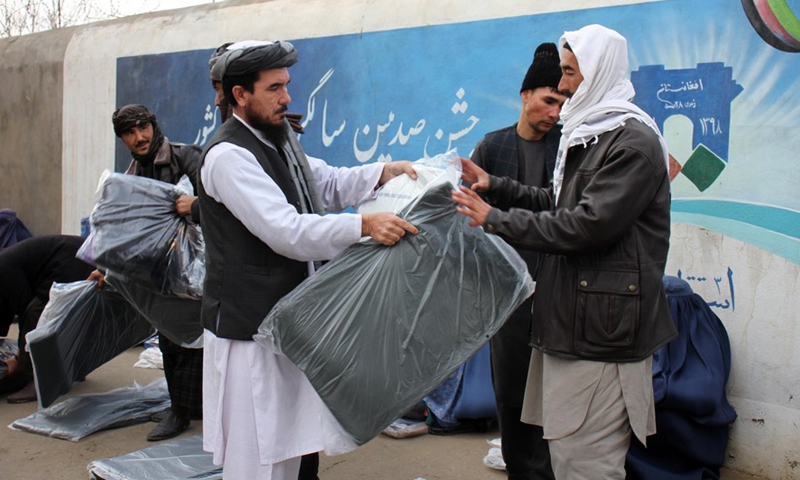 A man receives Chinese aid in Shiberghan, capital of Afghanistan's Jawzjan Province, Jan. 1, 2022.Photo:Xinhua