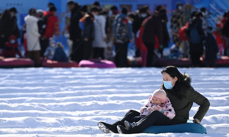 People enjoy snow-tubing at an ice and snow carnival held in Taoranting Park during the New Year holiday in Beijing, capital of China, Jan. 2, 2022.Photo:Xinhua