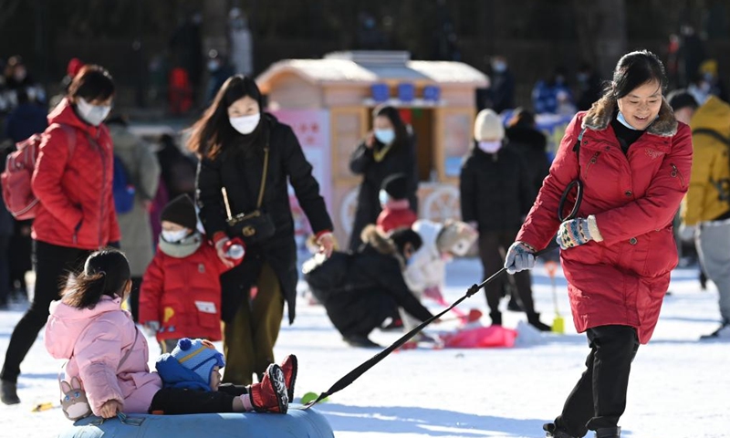 People enjoy snow-tubing at an ice and snow carnival held in Taoranting Park during the New Year holiday in Beijing, capital of China, Jan. 2, 2022.Photo:Xinhua