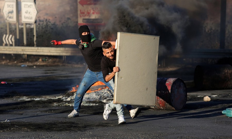 Protesters clash with Israeli soldiers during an anti-Israel protest at Huwwara checkpoint near the West Bank city of Nablus, on May 15, 2021.(Photo: Xinhua)