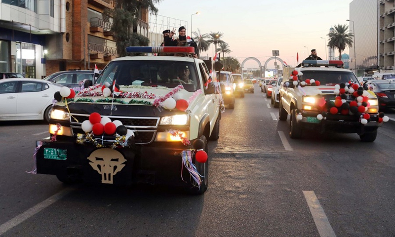 Military vehicles decorated with colored ribbons and balloons, in celebration of the Iraqi Army Day in Baghdad, Iraq, on Jan. 6, 2022.(Photo: Xinhua)