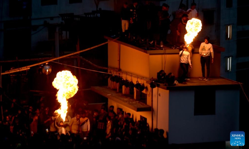 Fire breathers perform during Sakrain festival in Dhaka, capital of Bangladesh, on Jan. 14, 2022. People in Dhaka celebrate Sakrain festival, also known as Ghuri Utsob or Kite festival, at the end of Poush, the ninth month of the Bengali calendar (Jan. 14 or 15 in Gregorian calendar). Photo:Xinhua