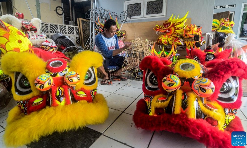 A worker makes a traditional lion head for the upcoming Chinese New Year celebration in Bogor, West Java, Indonesia, on Jan. 15, 2022.Photo:Xinhua