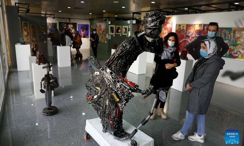 People visit an art exhibition during Egypt's 1st World Art Forum in Cairo, Egypt, on Jan. 16, 2022. (Photo: Xinhua)