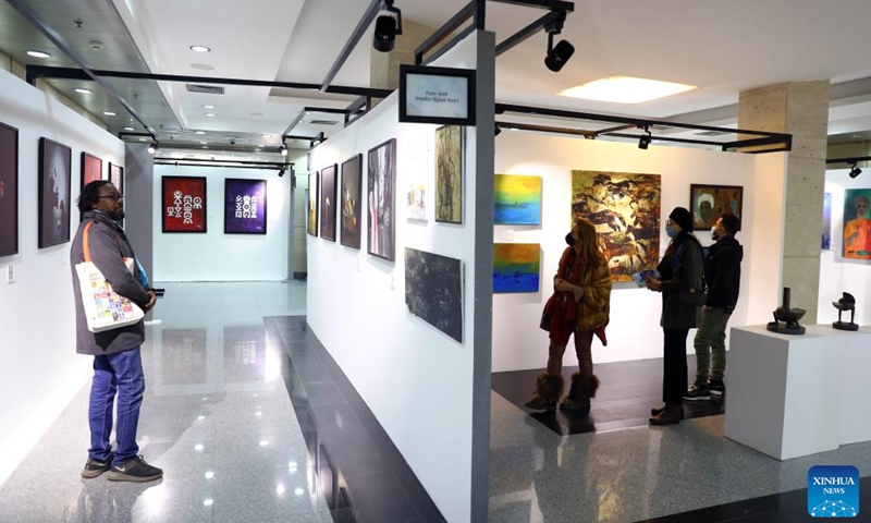 People visit an art exhibition during Egypt's 1st World Art Forum in Cairo, Egypt, on Jan. 16, 2022. (Photo: Xinhua)