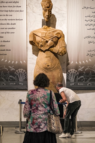 Visitors inspect a fragmented statue at the main hall of the new National Museum of Egyptian Civilization in Egypt's capital Cairo on May 26, 2021. Photos: AFP  A visitor explores the National Museum of Egyptian Civilization on May 26, 2021.