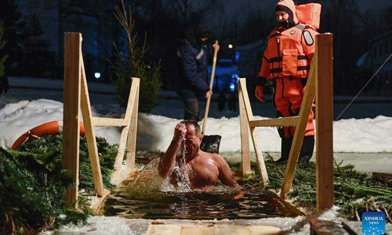 A man bathes in the icy water during the Orthodox Epiphany celebrations in Moscow, Russia, on Jan. 18, 2022.(Photo: Xinhua)