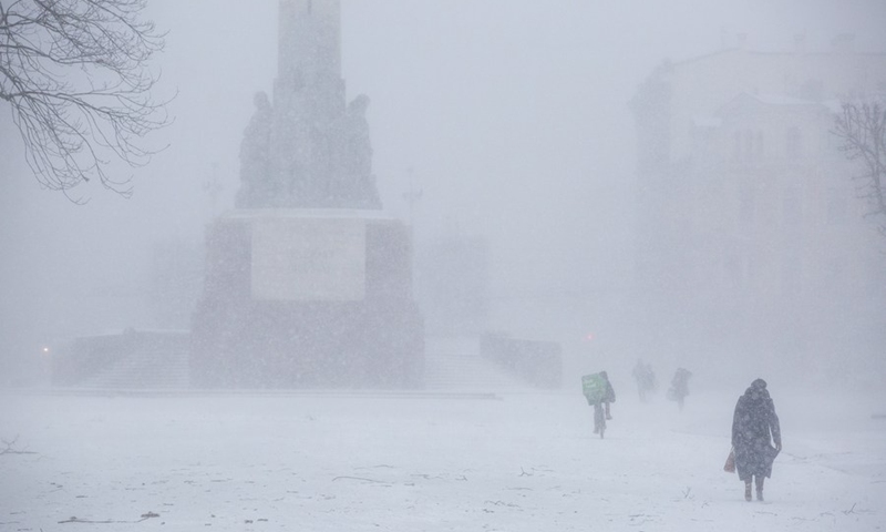 People walk in the snow in Riga, Latvia, on Jan. 17, 2022.(Photo: Xinhua)