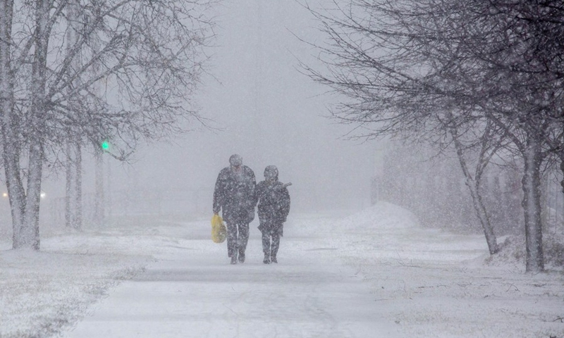 People walk in the snow in Riga, Latvia, on Jan. 17, 2022.(Photo: Xinhua)