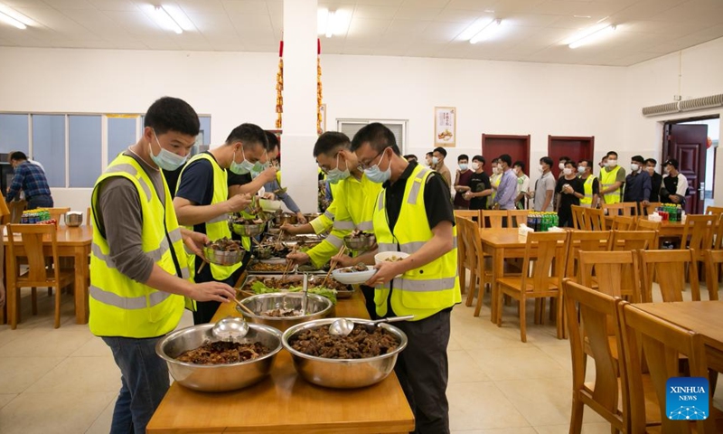 Staff members of the China-Laos Railway Luang Prabang Operation Management Center have dinner at the center in Luang Prabang, Laos, Jan. 22, 2022.Photo:Xinhua