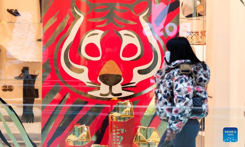 People buy decorations for Chinese New Year at a store in Kuala Lumpur, Malaysia, Jan. 23, 2022.Photo:Xinhua