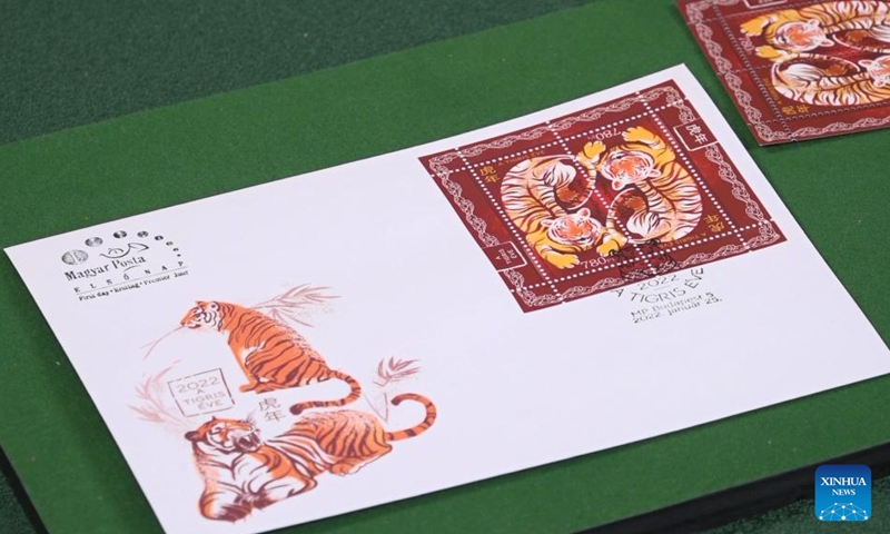 A first day cover with stamps for the Year of the Tiger is seen during the inauguration ceremony in Budapest, Hungary on Jan. 25, 2022. A special zodiac stamp issued by the Hungarian Post to celebrate the Chinese New Year of the Tiger was presented to the public in Hungary on Tuesday. (Photo: Xinhua)