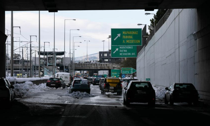 Stranded vehicles are seen on a road in Athens, Greece, on Jan. 26, 2022, two days after heavy snowfall hit the city. Photo:Xinhua