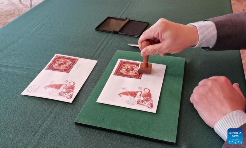 First day covers with stamps for the Year of the Tiger are seen during the inauguration ceremony in Budapest, Hungary on Jan. 25, 2022. A special zodiac stamp issued by the Hungarian Post to celebrate the Chinese New Year of the Tiger was presented to the public in Hungary on Tuesday. (Photo: Xinhua)