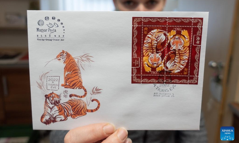 A first day cover with stamps for the Year of the Tiger is seen during the inauguration ceremony in Budapest, Hungary on Jan. 25, 2022. A special zodiac stamp issued by the Hungarian Post to celebrate the Chinese New Year of the Tiger was presented to the public in Hungary on Tuesday.(Photo: Xinhua)