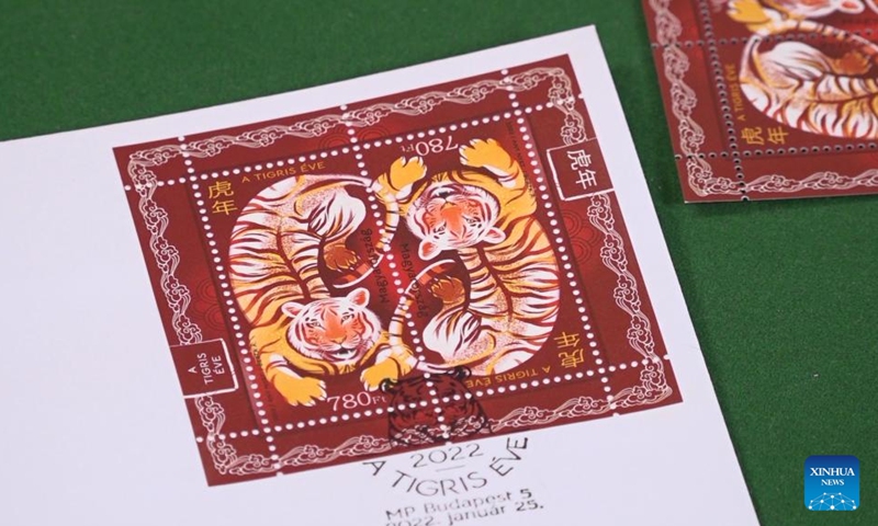 A first day cover with stamps for the Year of the Tiger is seen during the inauguration ceremony in Budapest, Hungary on Jan. 25, 2022. A special zodiac stamp issued by the Hungarian Post to celebrate the Chinese New Year of the Tiger was presented to the public in Hungary on Tuesday. (Photo: Xinhua)