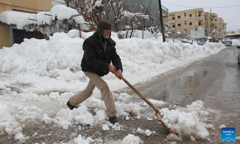 A man shovels snow from a road after snowstorms in the Bcharre district, northern Lebanon, on Jan. 28, 2022.(Photo: Xinhua)