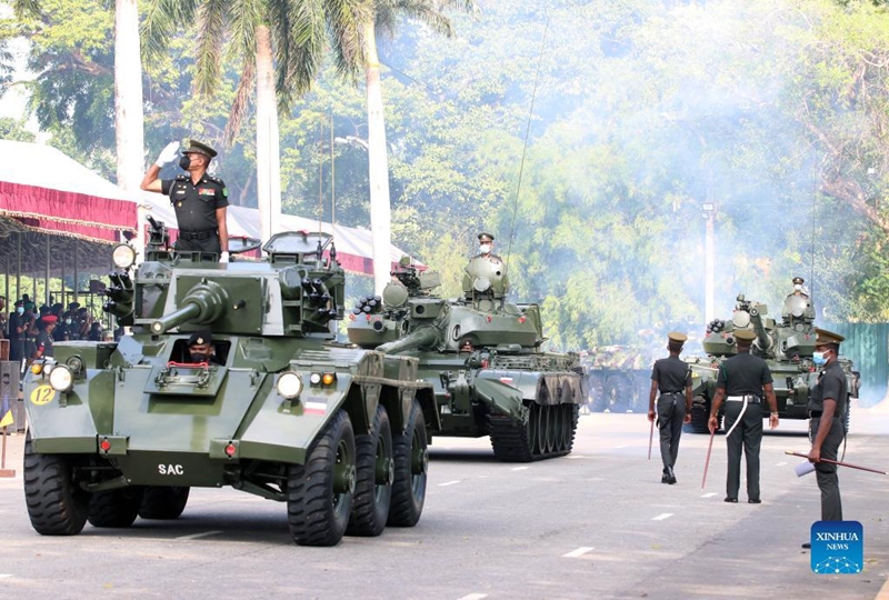 Military personnel wearing face masks take part in a rehearsal for the Independence Day parade in Colombo, Sri Lanka, on Jan. 31, 2022. Sri Lanka will celebrate its Independence Day on Feb. 4. (Photo by Ajith Perera/Xinhua)