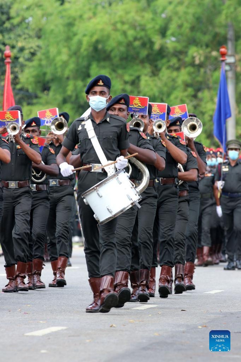 Military personnel wearing face masks take part in a rehearsal for the Independence Day parade in Colombo, Sri Lanka, on Jan. 31, 2022. Sri Lanka will celebrate its Independence Day on Feb. 4. (Photo by Ajith Perera/Xinhua)