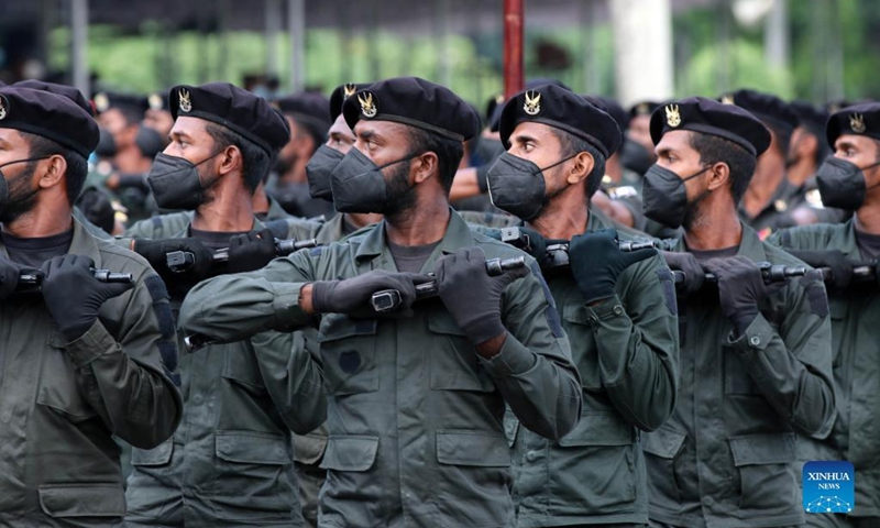 Military personnel wearing face masks take part in a rehearsal for the Independence Day parade in Colombo, Sri Lanka, on Jan. 31, 2022. Sri Lanka will celebrate its Independence Day on Feb. 4. (Photo by Ajith Perera/Xinhua)