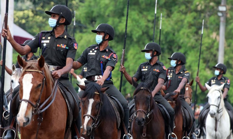 Military personnel wearing face masks take part in a rehearsal for the Independence Day parade in Colombo, Sri Lanka, on Jan. 31, 2022. Sri Lanka will celebrate its Independence Day on Feb. 4. (Photo by Ajith Perera/Xinhua)