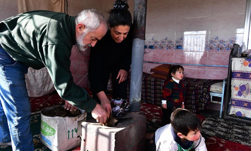 Al-Muthana Hasan al-Shoufi, 53, and his family use cow dung as heating fuel in Sweida, Syria, on Jan. 23, 2022.Photo:Xinhua