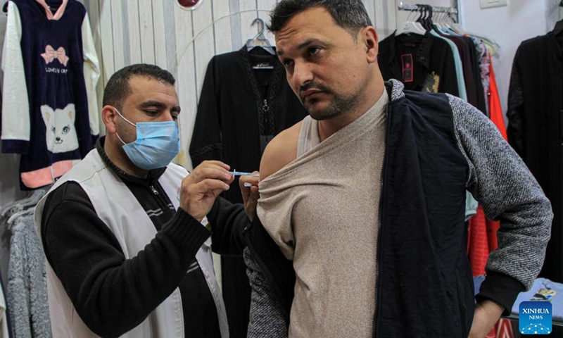 A Palestinian man receives a dose of COVID-19 vaccine during a vaccination campaign in Gaza City, on Feb. 7, 2022.(Photo: Xinhua)