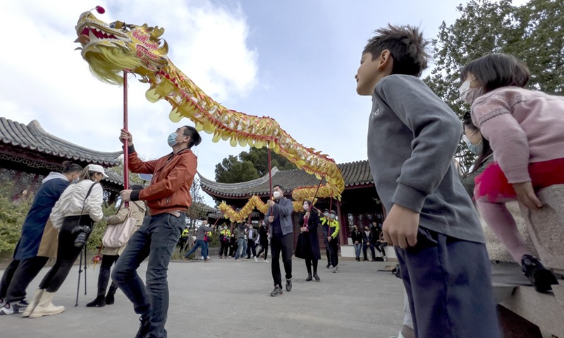 People dance the dragon in the Garden of Serenity, a traditional Chinese garden, in St. Lucia, Malta, on February 6, 2022. (Photo: Xinhua)