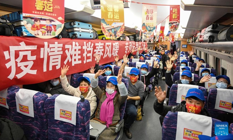 Migrant workers are seen on a special train at Zunyi Station in Zunyi, southwest China's Guizhou Province, Feb. 8, 2022.Photo:Xinhua