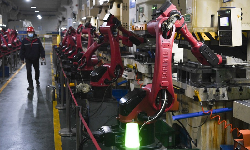 A staff member works at a workshop of a welding technology company in southwest China's Chongqing Municipality, Feb. 8, 2022.  (Photo: Xinhua)