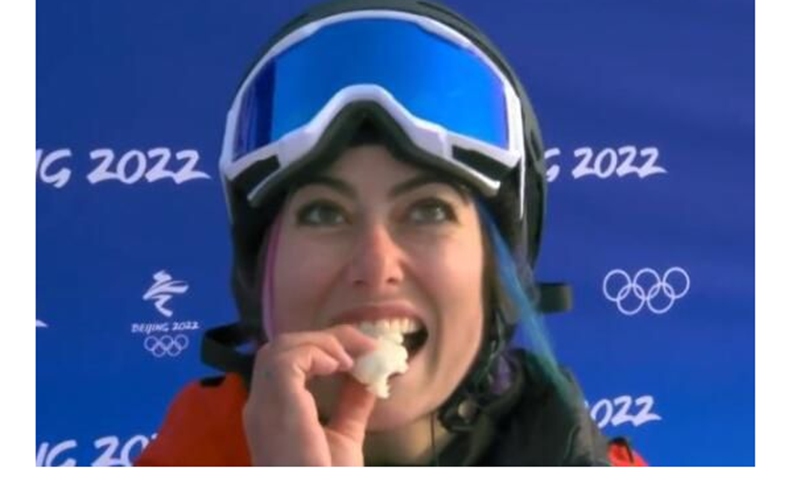 Jenise Spiteri, the first-ever snowboarder to represent the European island of Malta, pops one in her mouth when she gets to the base of Genting Snow Park and waits for her score on February 9, 2022. Photo: A screenshot from Web 